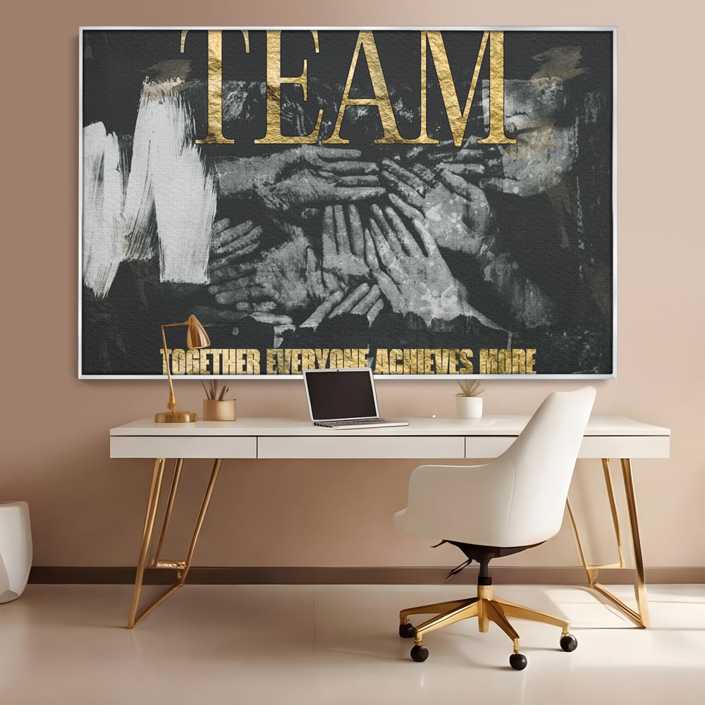 Tablou canvas cu tablou motivational cu maini si text, in rama de aluminiu argintiu, pe perete intr-un birou